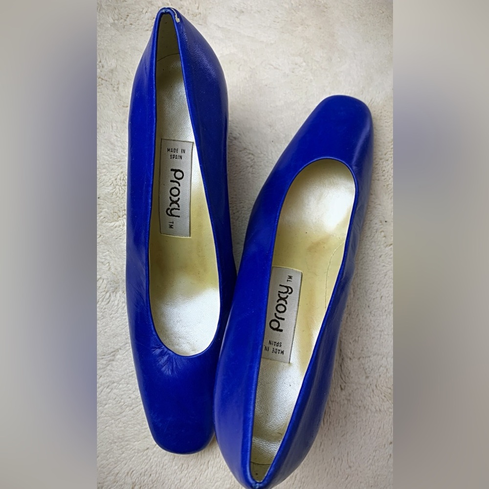 PO Royal blue kid leather pumps with embellished heel.